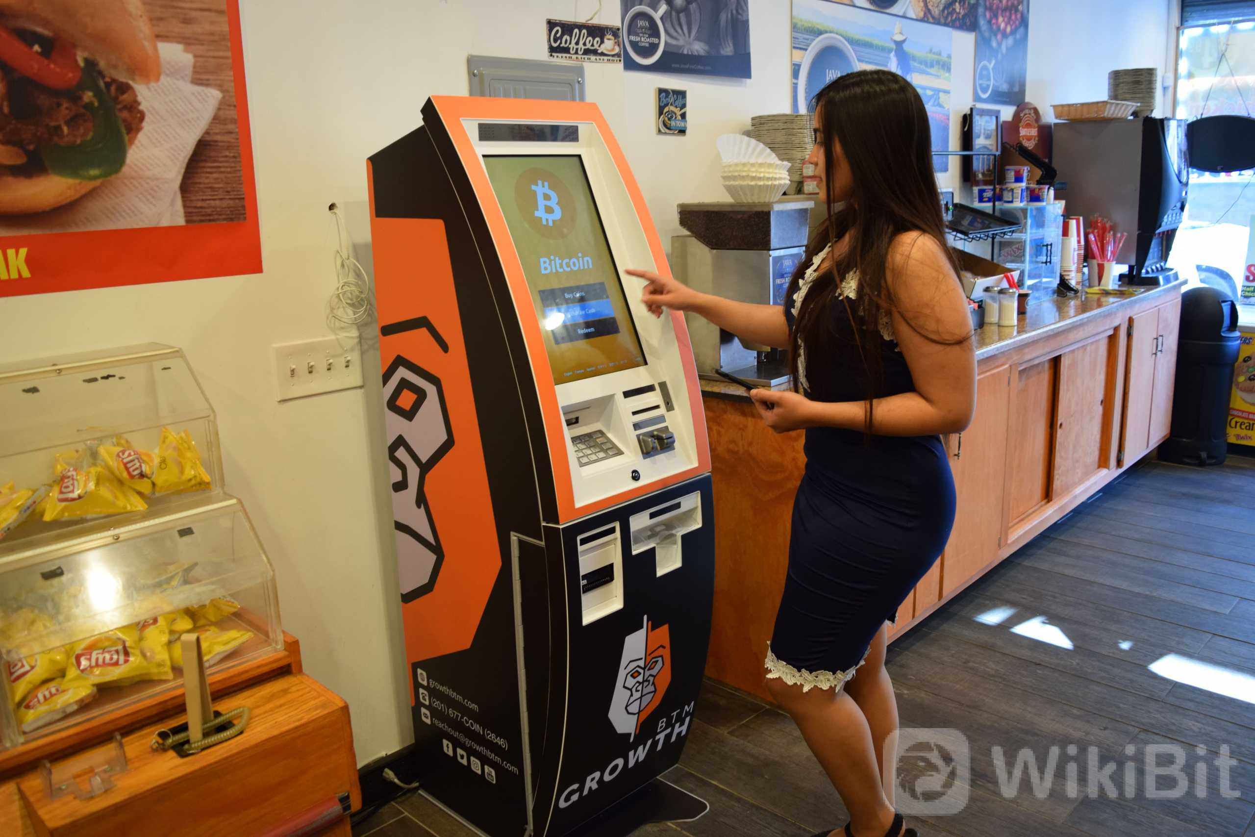 bitcoin-atm-being-used-by-model.jpg